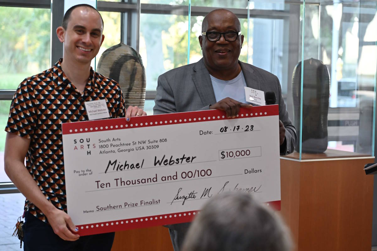 Michael Webster receives the check for the 2023 Southern Prize for Visual Arts Finalist